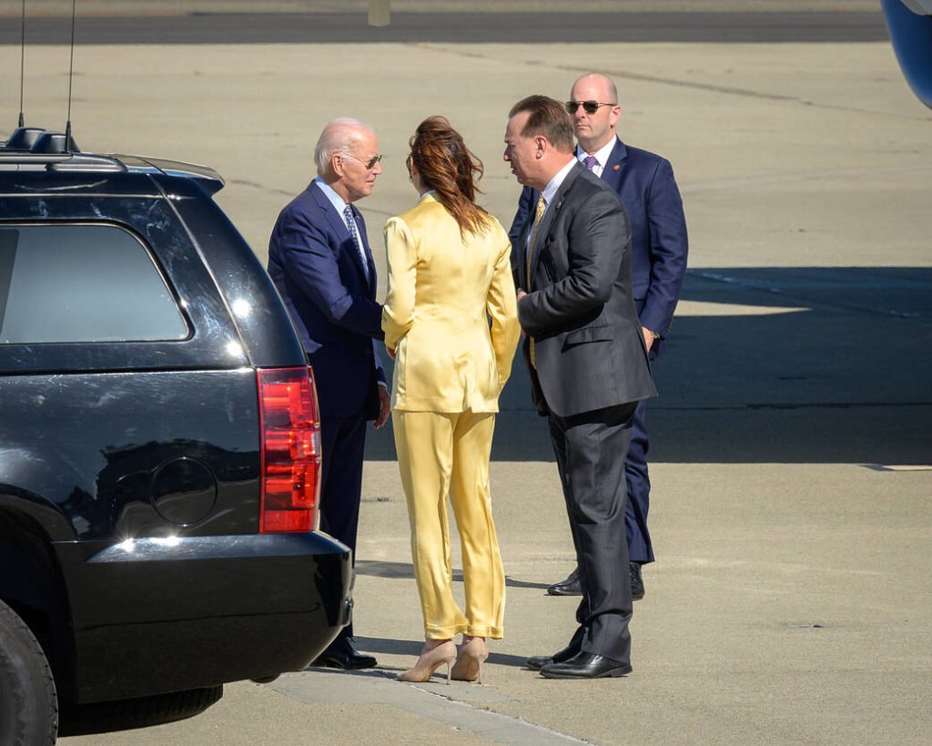 Biden, left, was greeted by Acting Deputy Center Director David Korsmeyer, right, and Santa Clara County supervisor Susan Ellenberg, center, before departing for a series of events in the region.